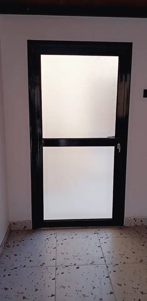 Dark-framed frosted glass door — Marhaba Aluminium & Metal Works