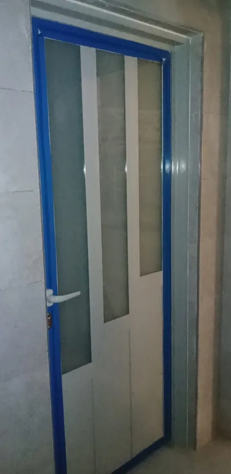 Narrow glazed door installation — Marhaba Aluminium & Metal Works