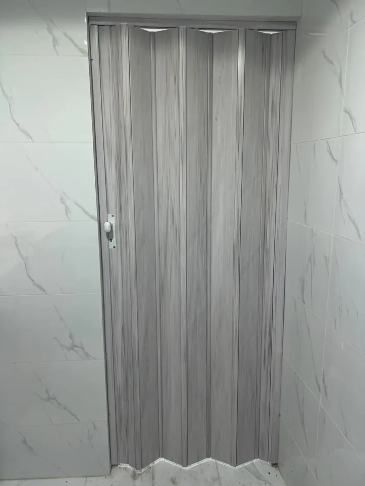 Light-coloured folding door — Marhaba Aluminium & Metal Works