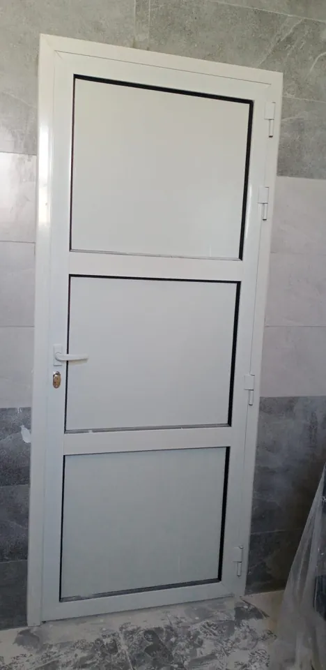 White inset-panel interior door — Marhaba Aluminium & Metal Works