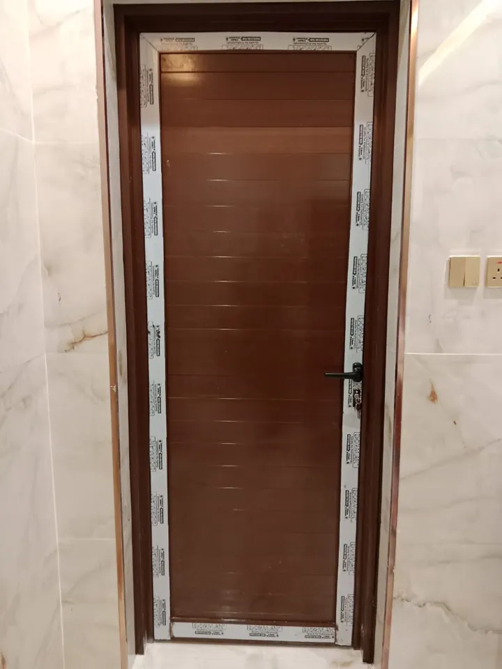 Wood-tone panel entrance — Marhaba Aluminium & Metal Works