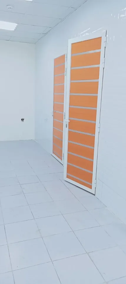 Warm-tone inset panel door — Marhaba Aluminium & Metal Works