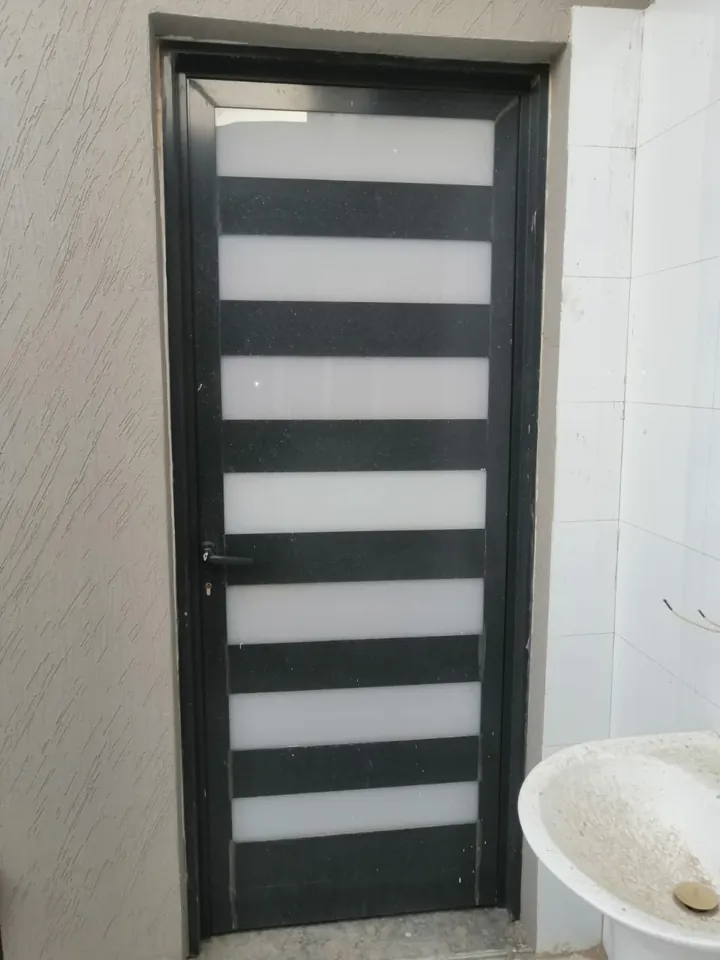 Dark door with frosted panels — Marhaba Aluminium & Metal Works