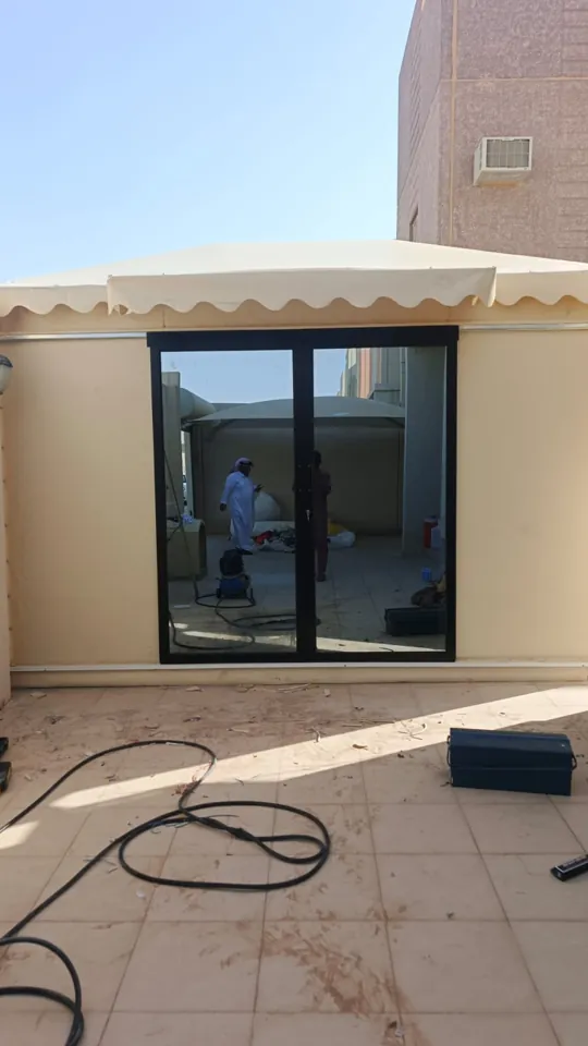 Dark-framed exterior window — Marhaba Aluminium & Metal Works