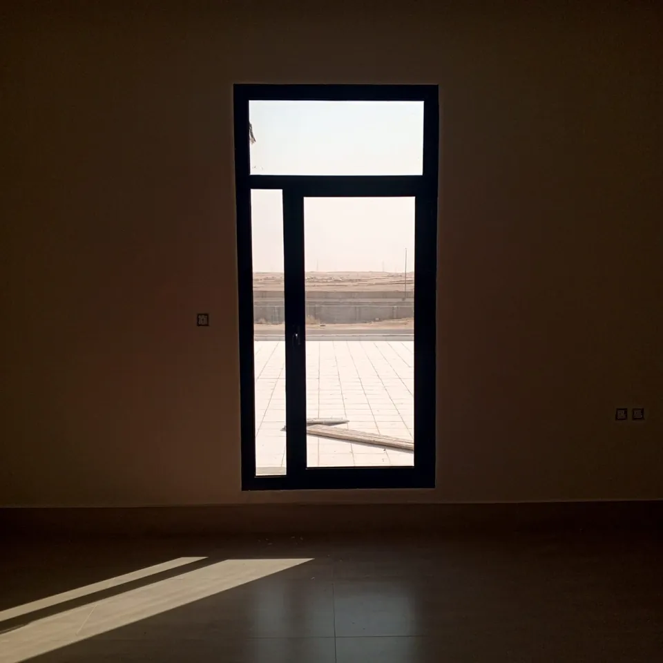 Tall black-frame window — Marhaba Aluminium & Metal Works