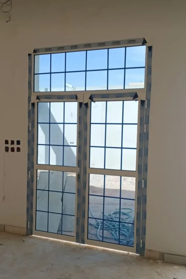 Tall window with grille — Marhaba Aluminium & Metal Works